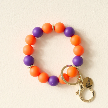 WSDEGY-HFKEY-OGPUR Darling Effect Gameday Hands-Free Keychain Wristlet - Orange & Purple